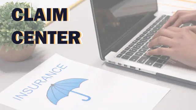 Claim Center: hands typing on a laptop beside an insurance document with an umbrella logo