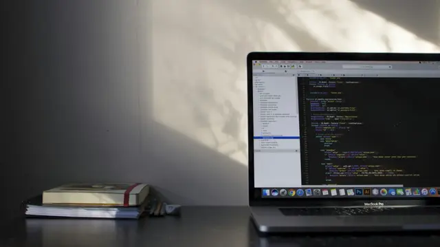 Laptop screen showing lines of programming code