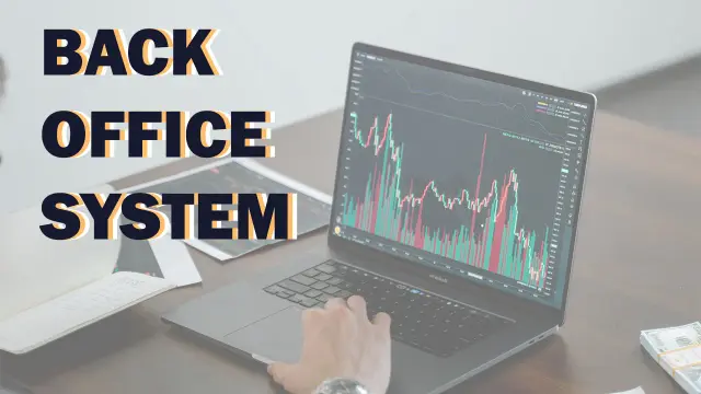 Back Office System: a laptop on a desk showing a candlestick price chart